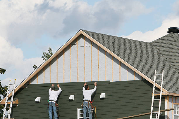 Professional Siding Contractor technician working in Scottsville, NY